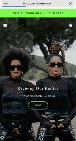 A photo of two young women in black sunglasses and slick outfits. There's a "Revive Our Roots" title.