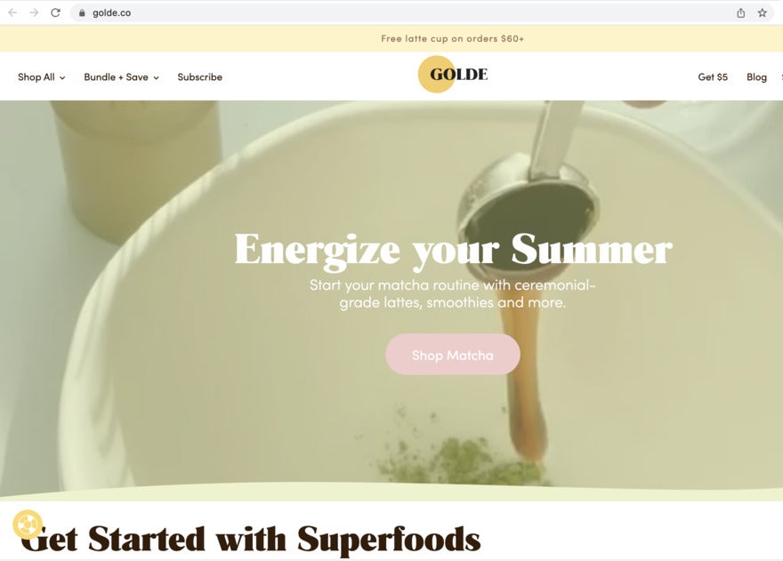 A photo of a superfood poured into a white bowl, and a headline saying "Energize your Summer".